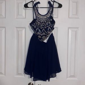 Navy two piece set. Top is bedazzled with beautiful different diamonds.
